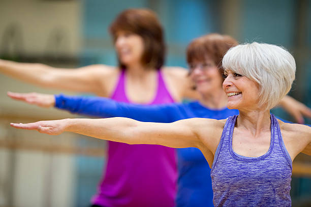 Active older women in a Yoga class.