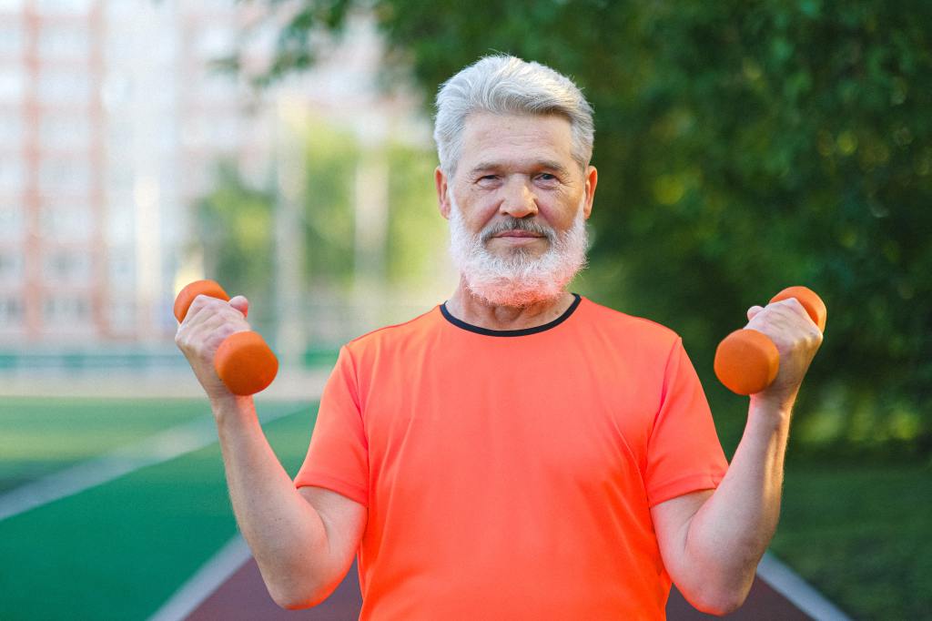 Older man exercising with dumbbells outdoors.