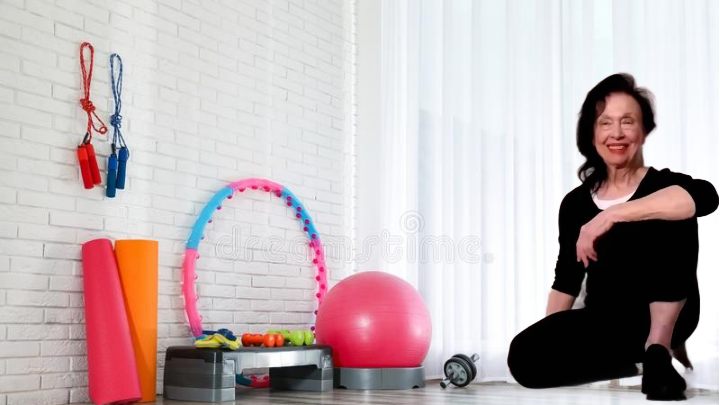 Irene Pastore, Personal Trainer, sitting in a fitness studio surrounded by equipment for core training, ready to guide active adults 55+.